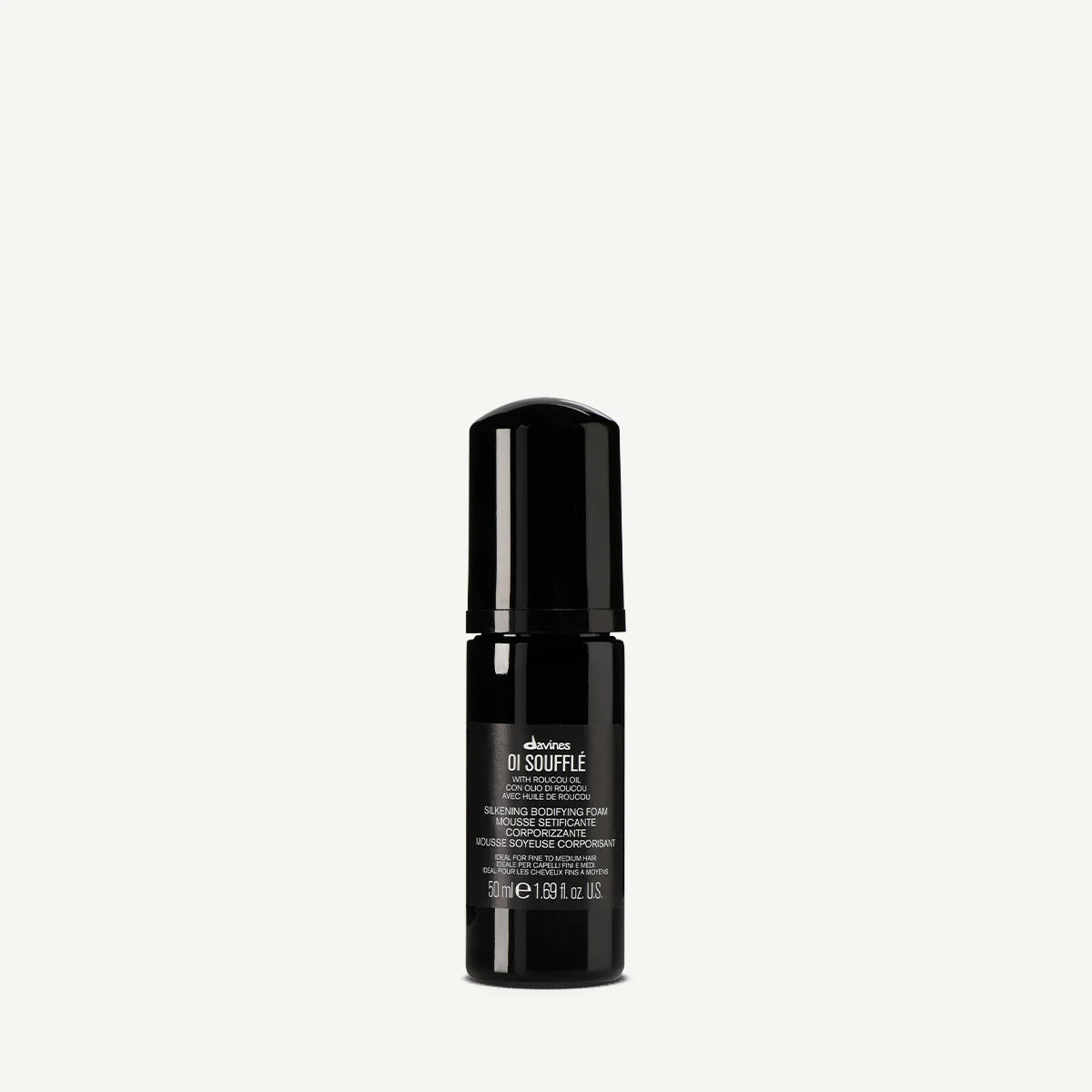 Davines OI Soufflé leave-in mousse 50ml. A lightweight liquid-to-foam formula with Roucou oil, providing body, shine, and heat protection for fine to medium hair.
