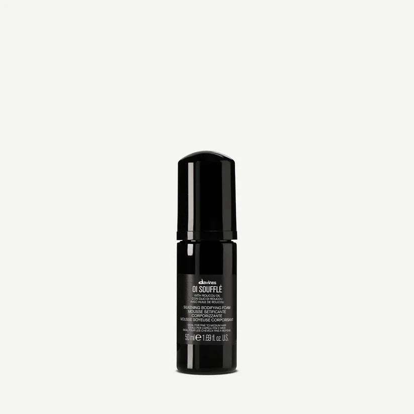 Davines OI Soufflé 50ml — lightweight bodifying foam infused with Roucou oil, designed to add volume, control frizz, and leave hair smooth, soft, and shiny.