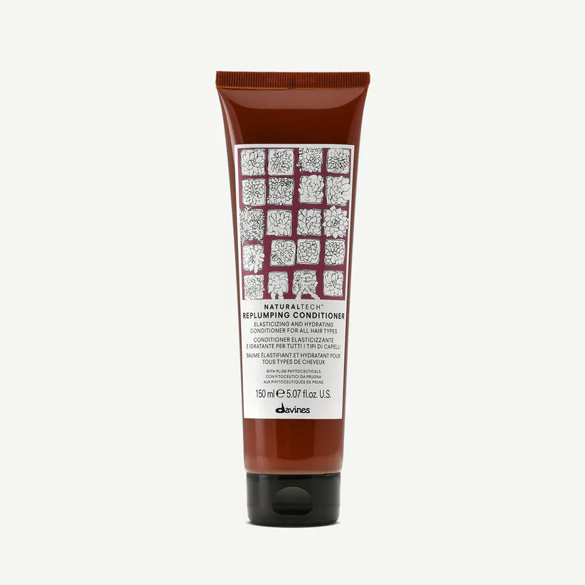Davines Naturaltech Replumping Conditioner — elasticity-enhancing and hydrating conditioner infused with plum phytoceuticals and hyaluronic acid to moisturize, smooth, and strengthen all hair types for fuller, softer results.