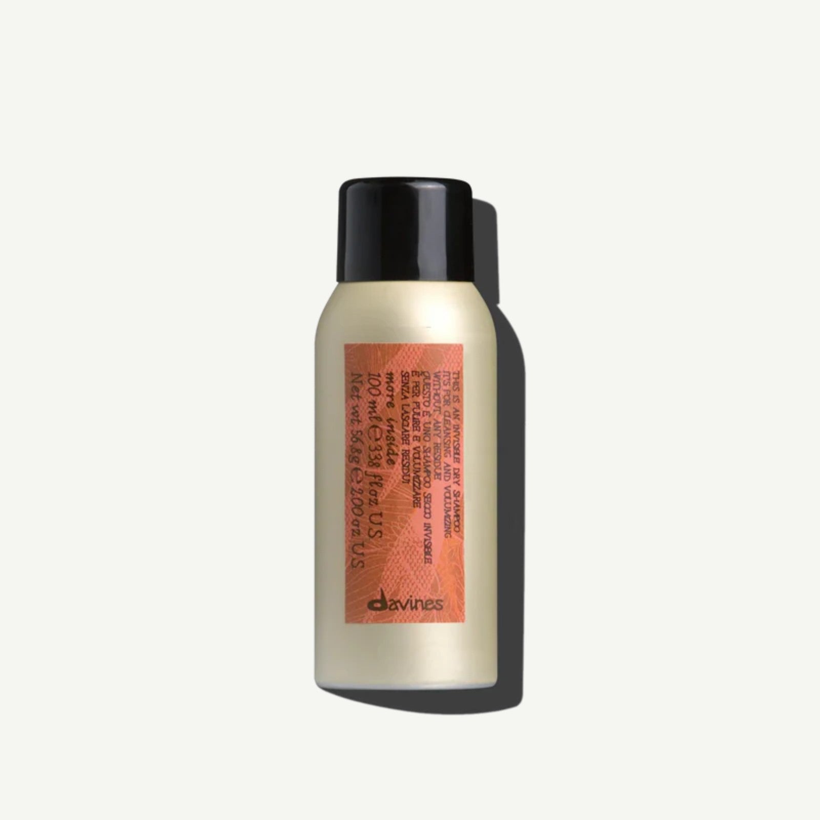 Travel-size Davines Invisible Dry Shampoo bottle, designed to refresh hair, absorb oil, and add volume without residue.