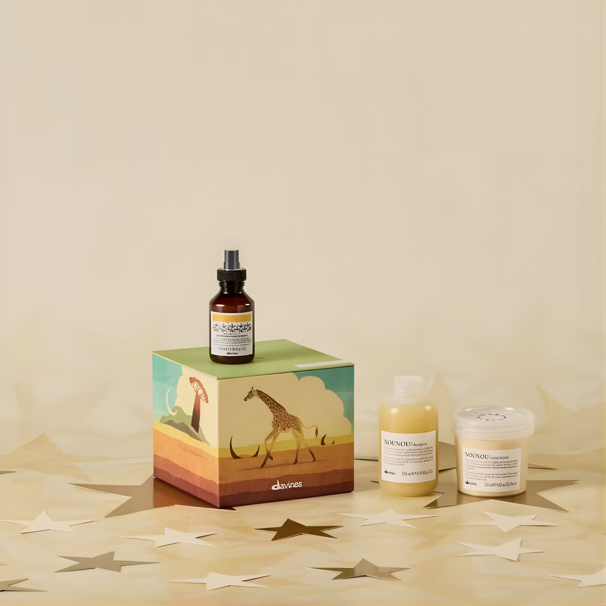 Davines hair care products on a decorative box with a giraffe design on a beige background