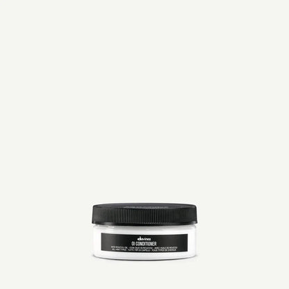 Davines OI Conditioner 75ml — travel-size beautifying conditioner infused with Roucou oil that deeply nourishes, detangles, and adds softness and shine for all hair types.