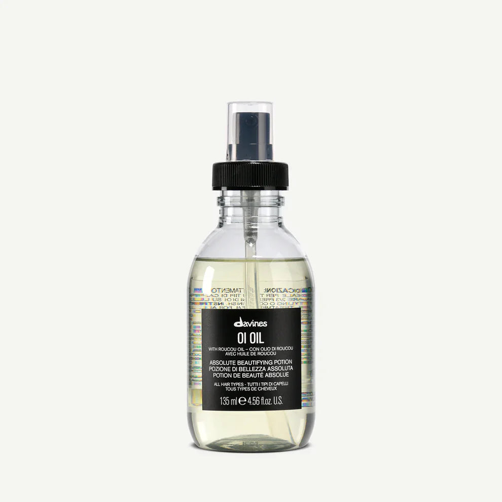 Bottle of Davines oil on a white background