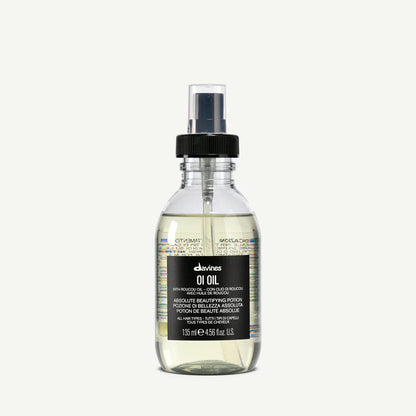 Bottle of Davines oil on a white background