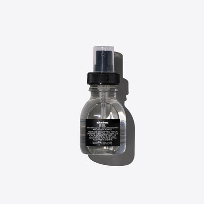 Davines OI Oil 50ml — lightweight finishing oil infused with Roucou oil, designed to add shine, smooth frizz, and protect all hair types for a silky, radiant finish.