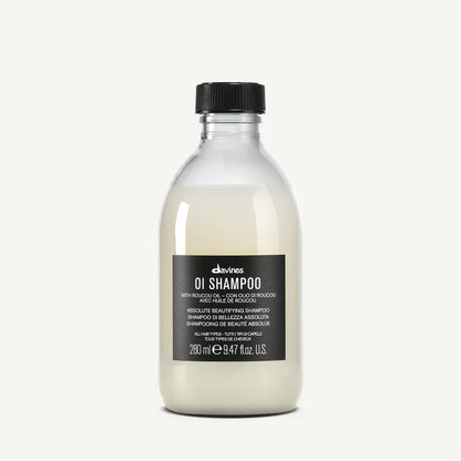Davines OI Shampoo 280ml — beautifying shampoo infused with Roucou oil, designed to gently cleanse, add shine, and enhance softness for all hair types.