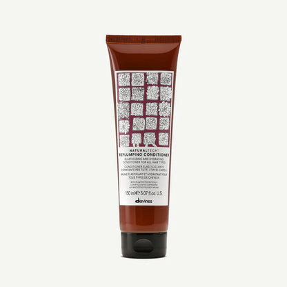 Davines Naturaltech Replumping Conditioner — elasticity-enhancing and hydrating conditioner infused with plum phytoceuticals and hyaluronic acid to moisturize, smooth, and strengthen all hair types for fuller, softer results.