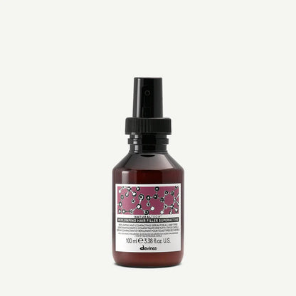 Davines Naturaltech Replumping Hair Filler Superactive — leave-in treatment serum infused with hyaluronic acid and plum phytoceuticals to boost elasticity, hydration, and volume for fine or weakened hair.