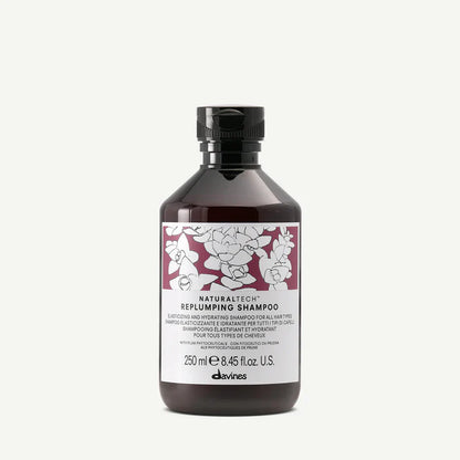 Davines Naturaltech Replumping Shampoo — hydrating and elasticity-boosting shampoo enriched with plum phytoceuticals and hyaluronic acid, designed to plump, strengthen, and add shine to fine or dehydrated hair.