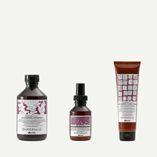 Davines Replumping Box — Naturaltech Replumping Shampoo, Conditioner, and Hair Filler Superactive trio designed to hydrate, plump, and strengthen fine or dehydrated hair with hyaluronic acid and plum phytoceuticals.